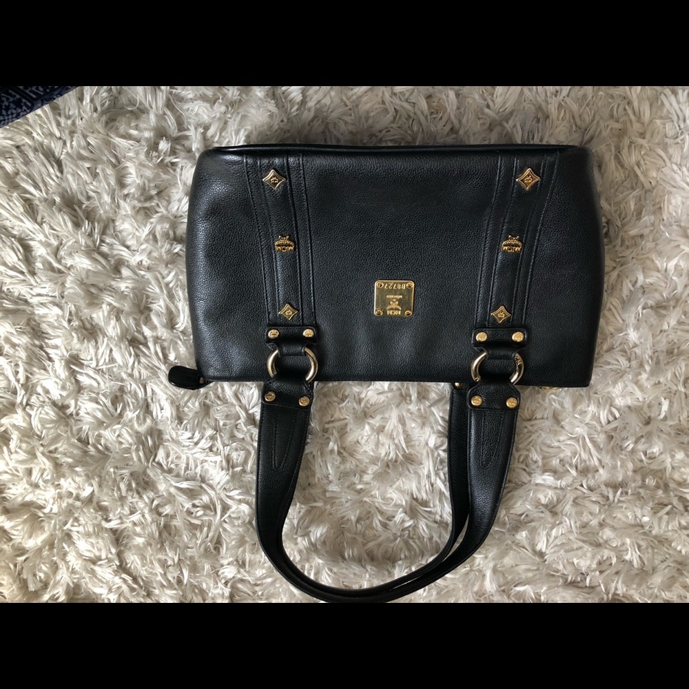 A black Ralph Lauren x MCM retro hang bag.